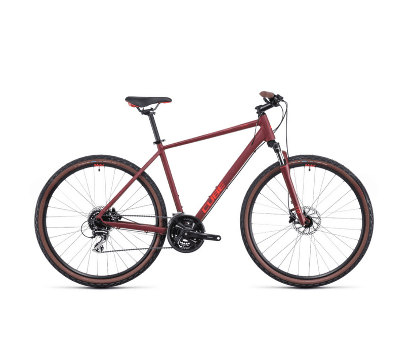 Maroon Cube Touring Pro hybrid bicycle with brown sidewall tires against white background